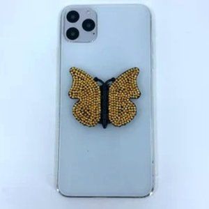 Black butterfly phone stand grip with gold rhinestones.